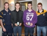 Young Whistlers Cathal O'Hagan and Peter Hasson receive an award from Kieran and CJ Mc Gourty